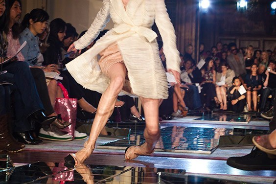 A model falls at Jason Wuʼs Spring 2010 show at the St. Regis Hotel, New York, New York.