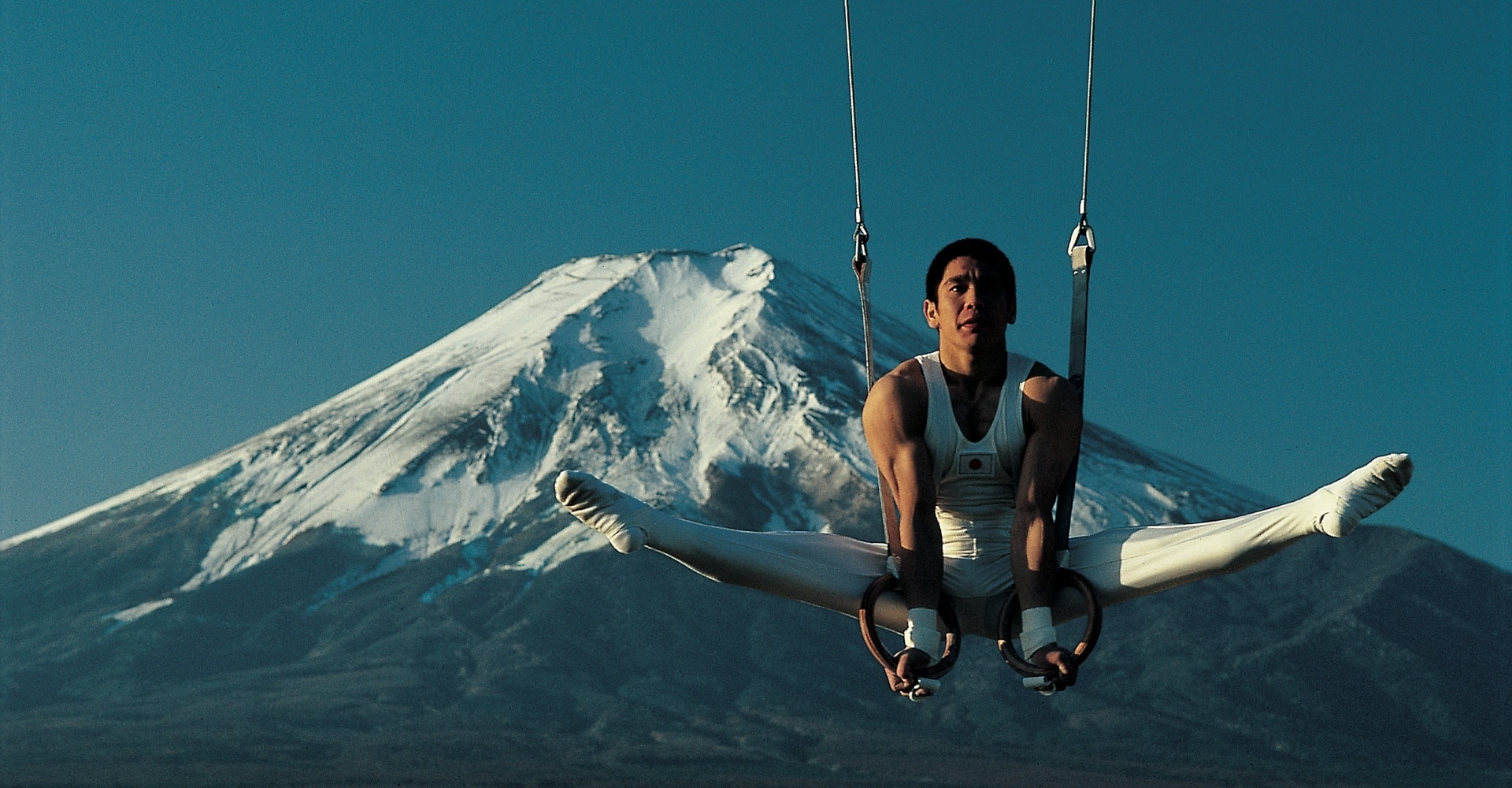 Koji Gushiken on rings in front of Mount Fuji, Japan. 