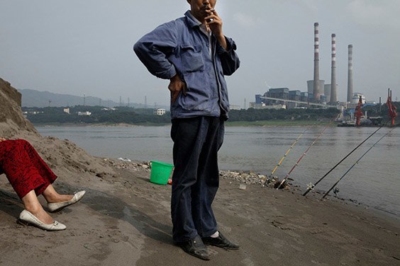 China, 2009

Near Chongqing, China, in the industrial town of Luohuangshi, a husband and wife fish in the Yangtze River. Waterways like this one are lifelines for some of Asia’s most densely settled areas, including China’s thirsty metropolises.