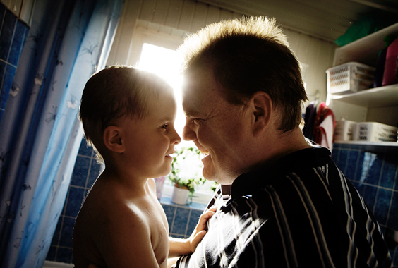 Vibe and her father Michael enjoy a playful moment in the bathroom at their home in Hundested, Denmark.