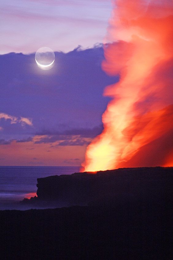 Lava flows into the sea as a crescent moon rises in this double exposure taken at dusk.