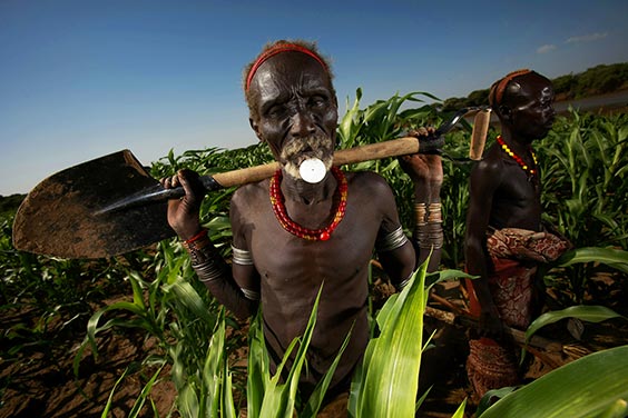 Loryra, South Omo, Ethopia
A Dassanech man tending to his fields along the Omo River. A hydroelectric company has plans to construct a massive dam that will inundate much of the Omo Valley, forcibly displacing tribal societies that have lived there for generations.