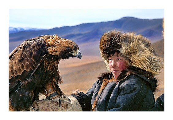 Deloun Highlands, Olgii Province, Outer Mongolia
Khoda Bergen, a young Kazakh shepherd, is being trained to hunt with his uncle’s hunting eagle.