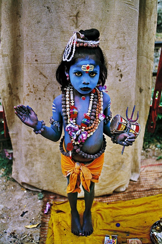 Haridwar, India

A young child dressed as the Hindu deity Lord Shiva, often depicted in the color blue, asks for money at a religious festival in Haridwar, India.