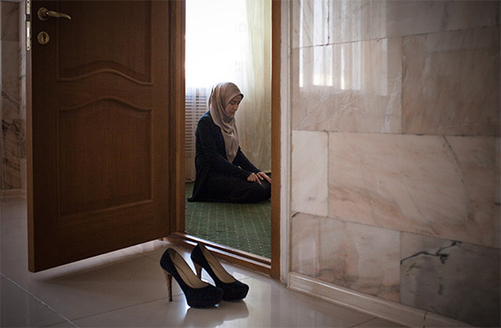 Amina Mutieva , 21, a student at the Islamic University in Grozny prays in a prayer room for women.