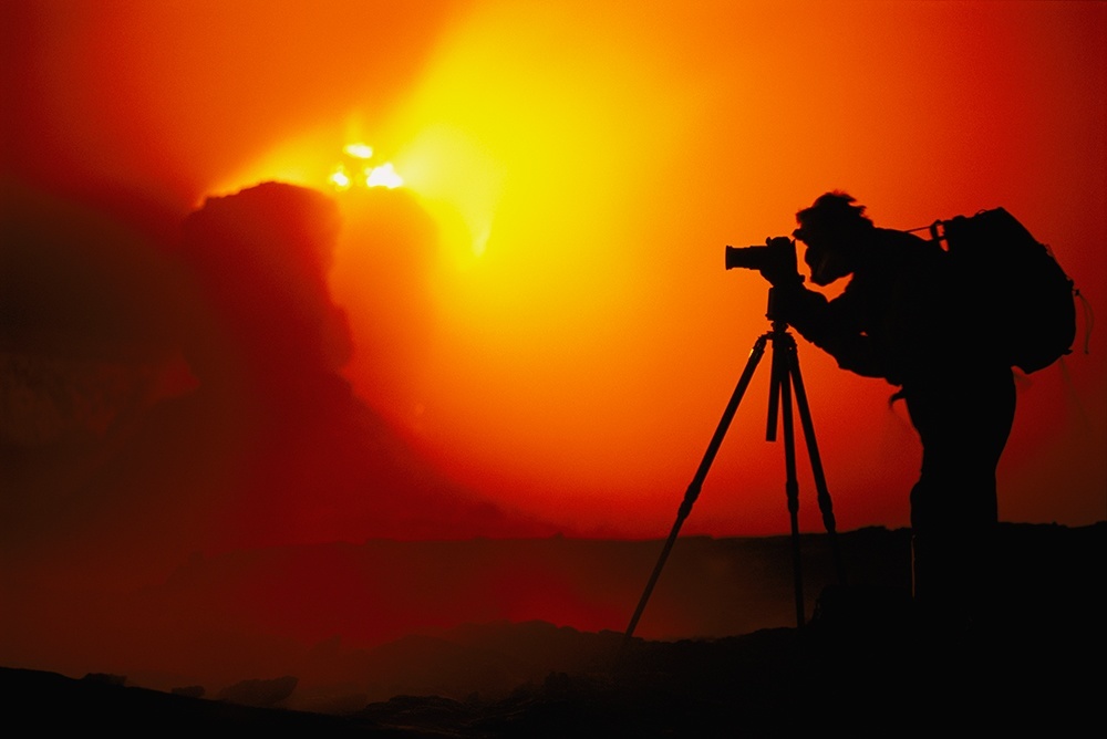 Frans Lanting at edge of volcano, Hawaii