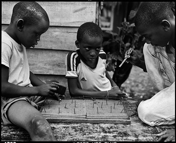 Children in Puente Nayero play an improvised game of table football.  The success of the Puente Nayero Humanitarian Space has encouraged residents on the neighboring street of Punta Icaco to begin organizing to create their own humanitarian space.