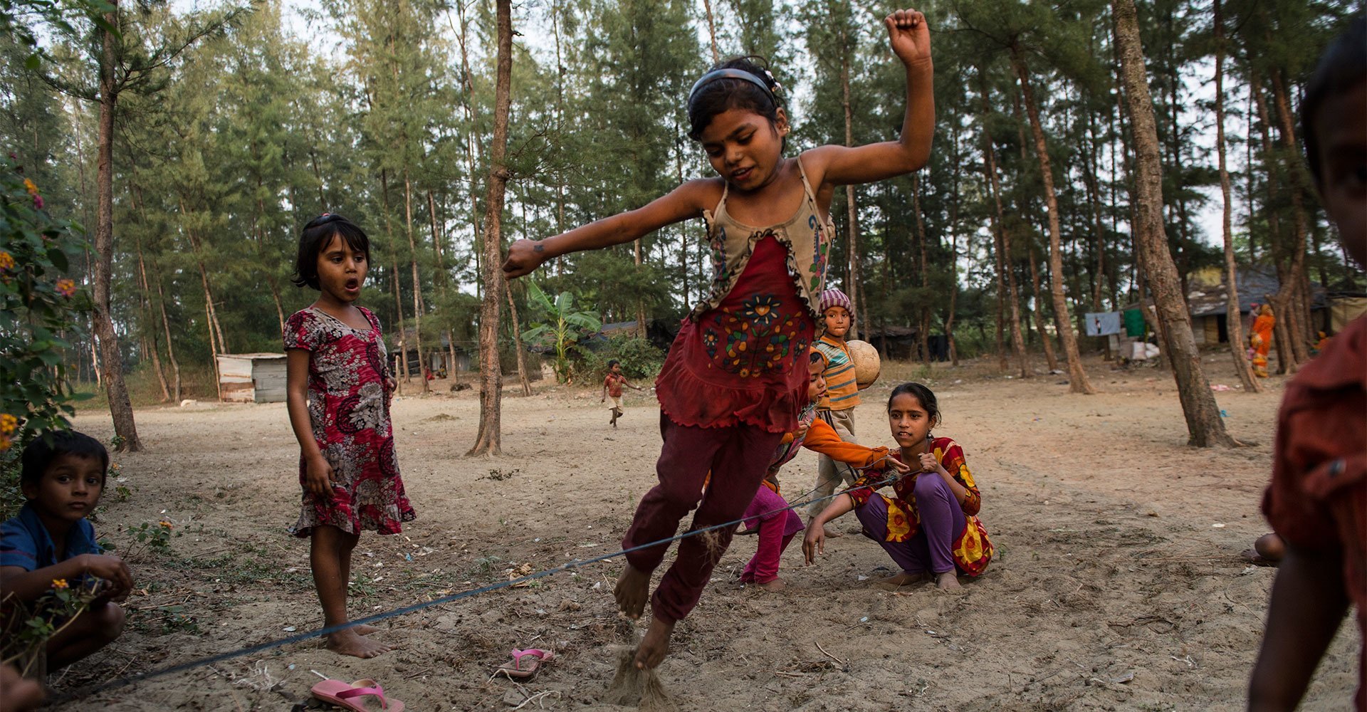 Ukhia settlement, Bangladesh, 2016: Munni, 8, jumps rope with her friends.  They all attend a nearby community school.
