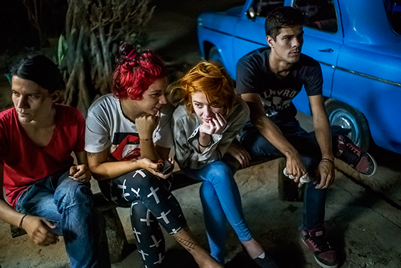 Helen and friends wait for their $1.00 cheese pizzas in Playa neighborhood, Havana, from the series Paradiso, 2015